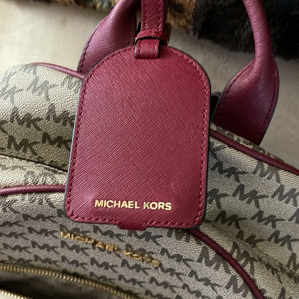 Michael Kors backpack a regular sized. Tan & burgundy with all the zippers. - Picture 8 of 8